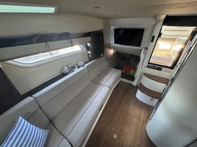 Slide: The Image of Interior of 2016 Regal 35 Sport Coupe with modern seating and entertainment area. - 24