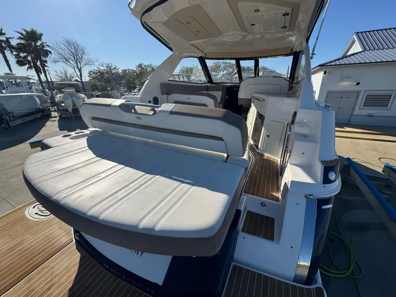 Slide: The Image of 2016 Regal 35 Sport Coupe boat with spacious seating and sleek design. - 36