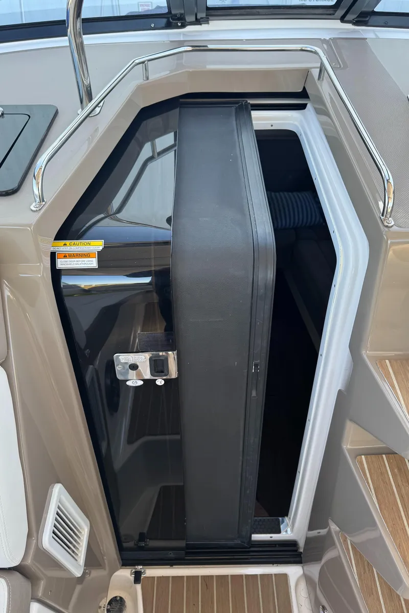 Slide: The Image of 2016 Regal 35 Sport Coupe cabin entrance with sleek design and modern features. - 38
