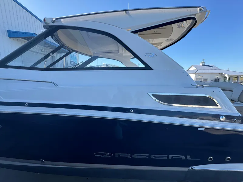 Slide: The Image of 2016 Regal 35 Sport Coupe boat with sleek design and modern features. - 9