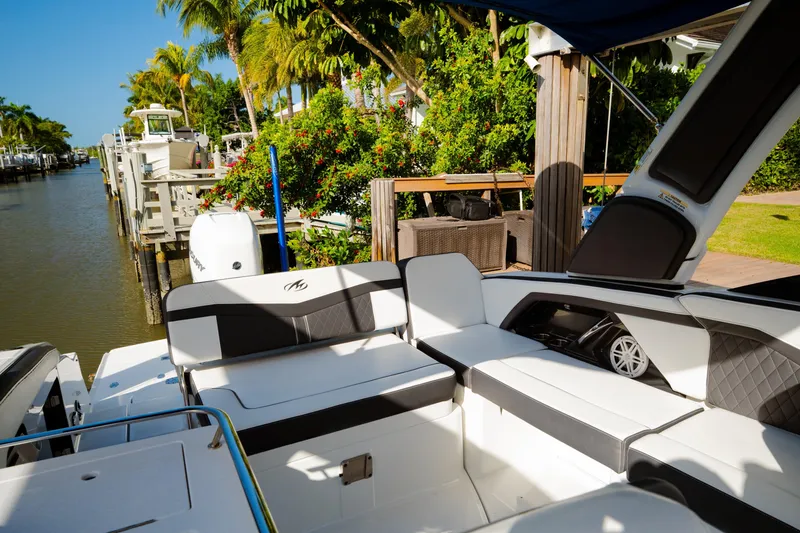 Slide: The Image of 2021 Monterey 255SS Super Sport boat interior by a scenic canal. - 17