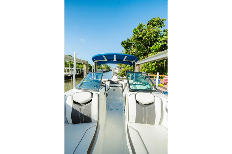 Slide: The Image of 2021 Monterey 255SS Super Sport boat with sleek design, docked under clear blue sky. - 5