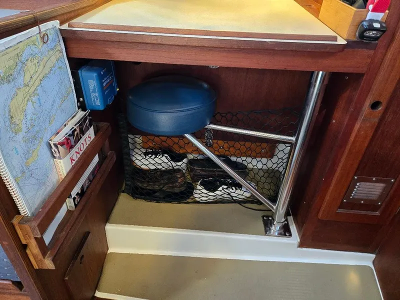 Slide: The Image of Interior of a 1991 Freedom F-38 sailboat with navigation tools and storage. - 40