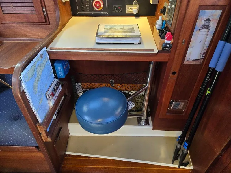 Slide: The Image of Navigation station in a 1991 Freedom F-38 sailboat with charts and equipment. - 41