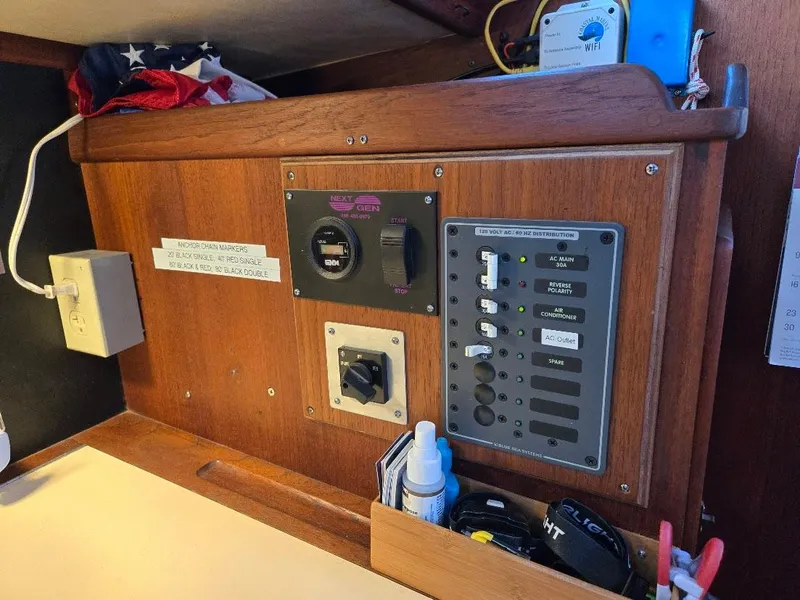 Slide: The Image of Control panel of a 1991 Freedom F-38 boat with switches and gauges. - 44