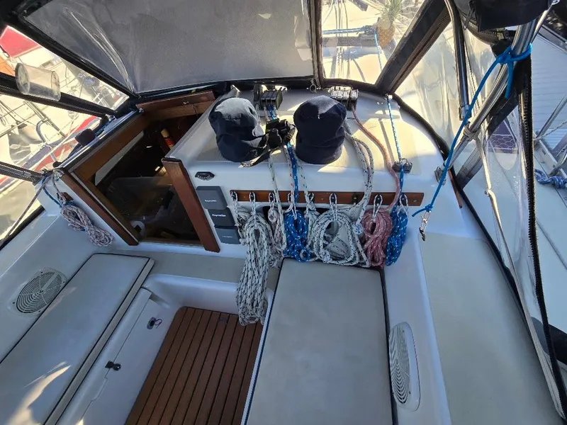 Slide: The Image of Cockpit of 1991 Freedom F-38 sailboat with ropes and equipment neatly organized. - 9