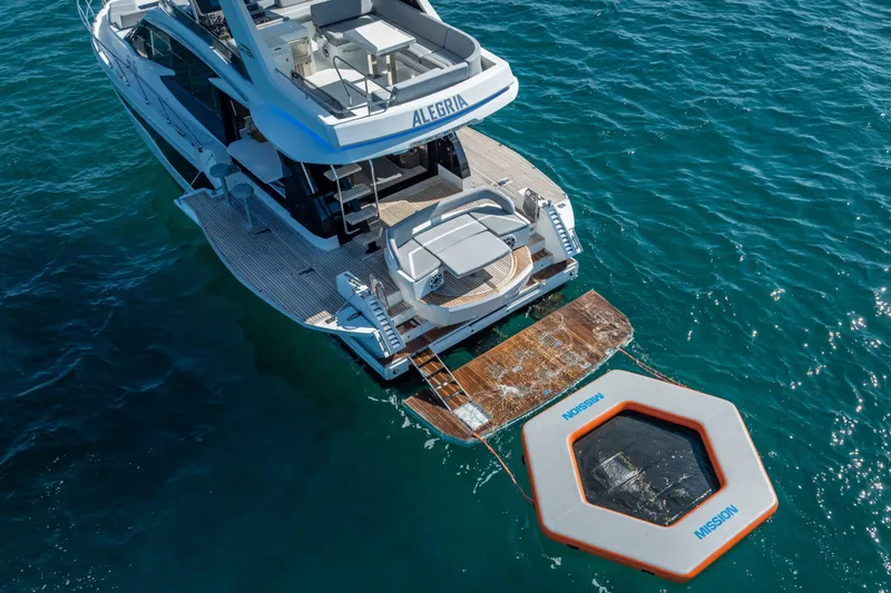 Slide: The Image of Aerial view of 2021 Galeon 500 Fly yacht with swim platform and floating dock. - 2