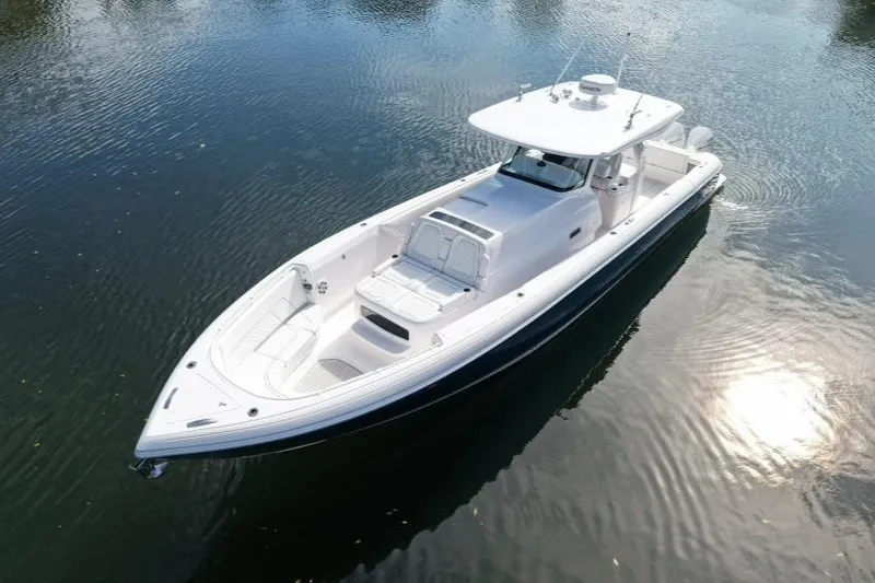 The Image of 2022 Intrepid 407 Panacea boat on calm water, showcasing sleek design and spacious deck. - 0