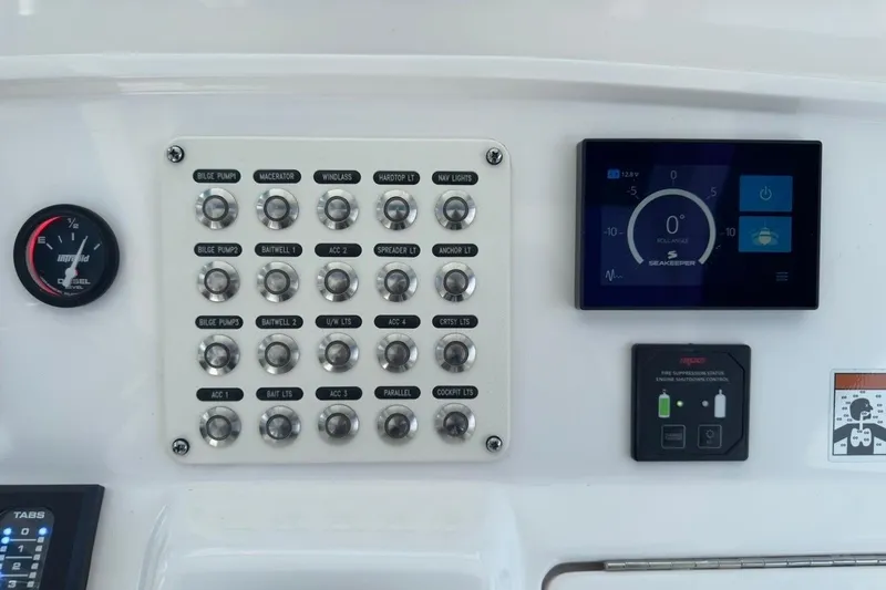 Slide: The Image of Control panel of 2022 Intrepid 407 Panacea boat with switches and digital display. - 101