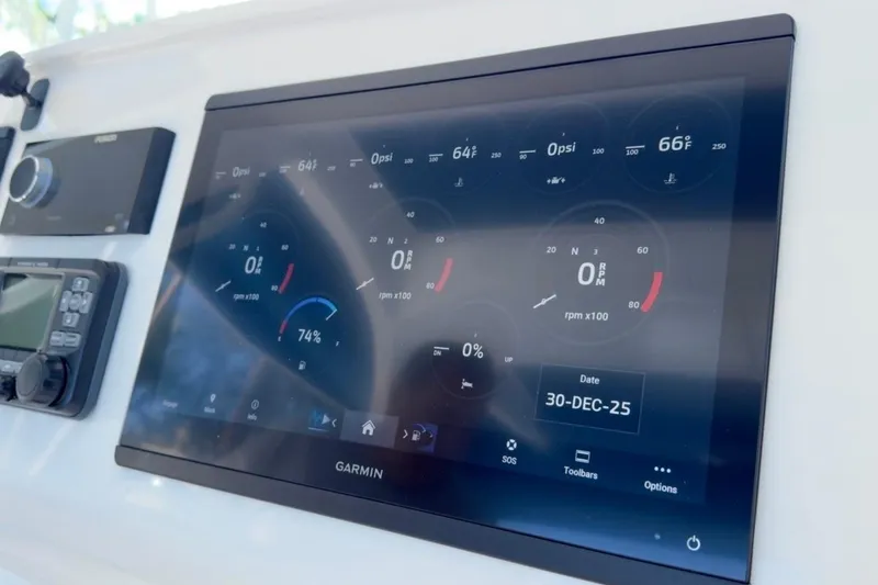 Slide: The Image of Garmin display on 2022 Intrepid 407 Panacea boat dashboard showing navigation and engine data. - 106