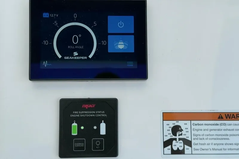 Slide: The Image of Control panel of 2022 Intrepid 407 Panacea with Seakeeper and Fireboy systems. - 108