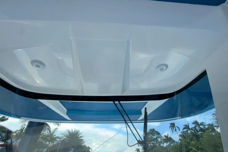 Slide: The Image of 2022 Intrepid 407 Panacea boat roof with integrated lighting and clear sky view. - 109