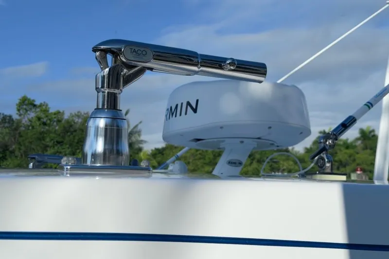 Slide: The Image of Close-up of 2022 Intrepid 407 Panacea boat's radar and fishing rod holder. - 112