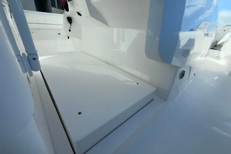 Slide: The Image of 2022 Intrepid 407 Panacea boat interior with sleek white deck and seating area. - 114