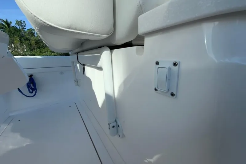 Slide: The Image of 2022 Intrepid 407 Panacea boat interior with white seating and deck details. - 118