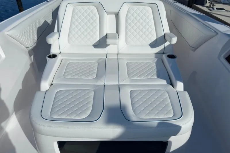 Slide: The Image of Luxurious white seating on 2022 Intrepid 407 Panacea boat, featuring quilted upholstery. - 121