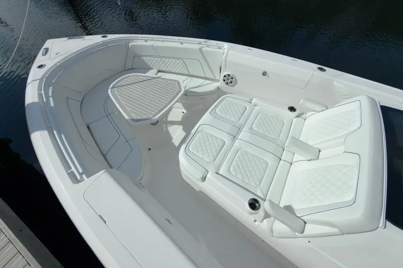 Slide: The Image of Luxurious seating area on 2022 Intrepid 407 Panacea boat, featuring white cushioned seats. - 136