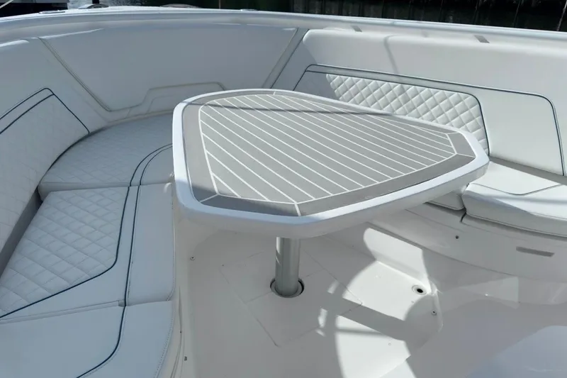 Slide: The Image of Luxurious seating area on 2022 Intrepid 407 Panacea boat with stylish table and cushions. - 138