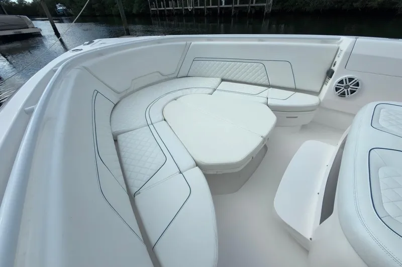 Slide: The Image of Luxurious seating area on 2022 Intrepid 407 Panacea boat, featuring white cushioned seats. - 139