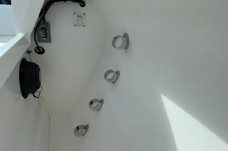 Slide: The Image of Interior view of 2022 Intrepid 407 Panacea boat, featuring wall-mounted fixtures. - 140