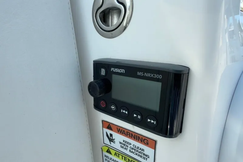 Slide: The Image of Fusion MS-NRX300 audio control on 2022 Intrepid 407 Panacea boat dashboard. - 142