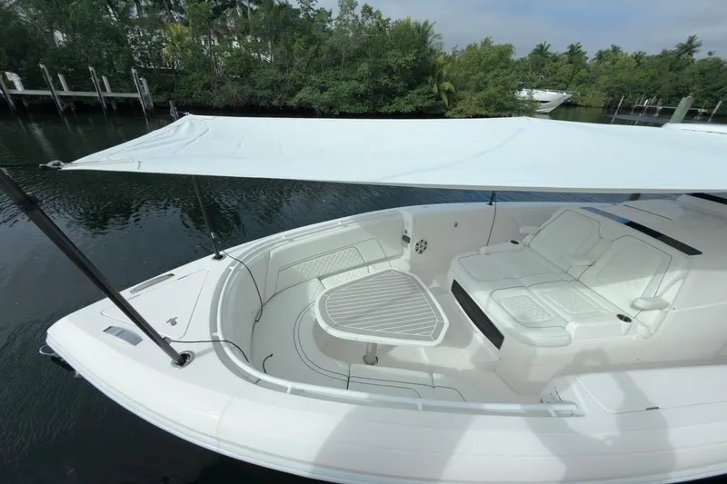 Slide: The Image of 2022 Intrepid 407 Panacea boat with shaded seating area and sleek design. - 151