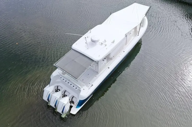 Slide: The Image of Aerial view of 2022 Intrepid 407 Panacea boat on calm water. - 161