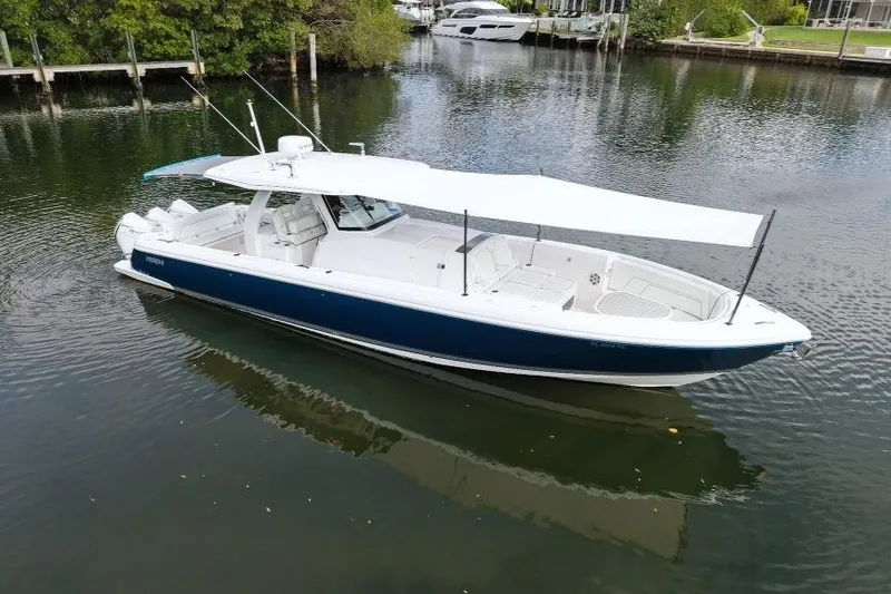 Slide: The Image of 2022 Intrepid 407 Panacea boat with canopy on calm water. - 163