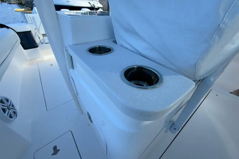 Slide: The Image of 2022 Intrepid 407 Panacea boat interior with cup holders and seating area. - 17