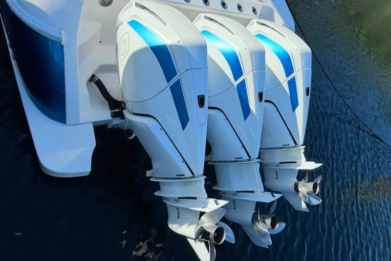 Slide: The Image of Triple outboard engines on a 2022 Intrepid 407 Panacea boat, viewed from above. - 25