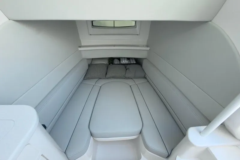 Slide: The Image of 2022 Intrepid 407 Panacea cabin interior with cushioned seating and window. - 31