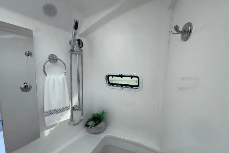 Slide: The Image of Luxurious bathroom in 2022 Intrepid 407 Panacea boat with modern fixtures and window. - 40