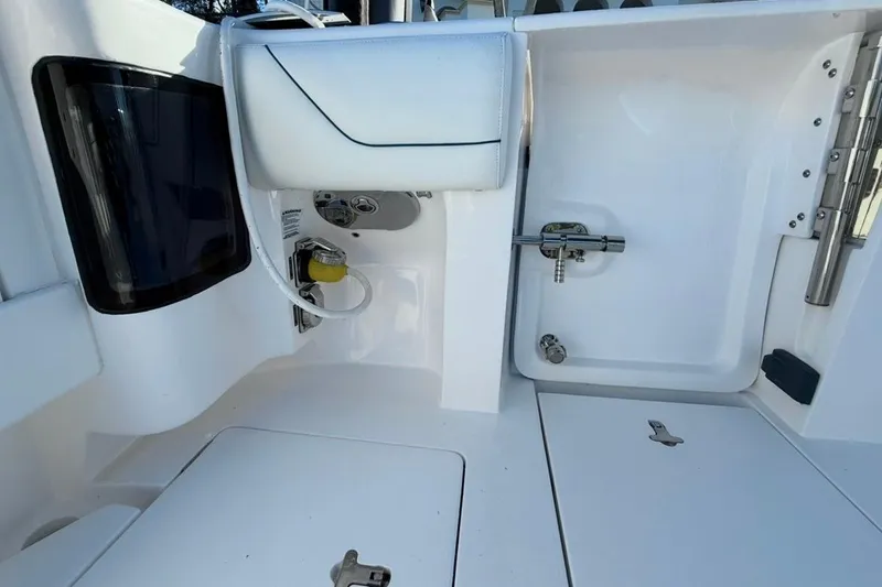 Slide: The Image of 2022 Intrepid 407 Panacea boat interior with storage compartments and sleek design. - 52