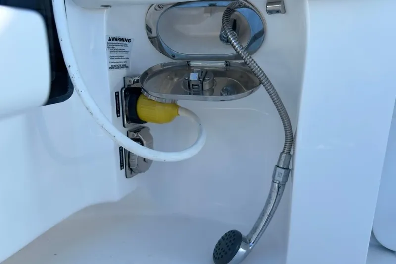 Slide: The Image of 2022 Intrepid 407 Panacea boat shower and power outlet detail. - 53