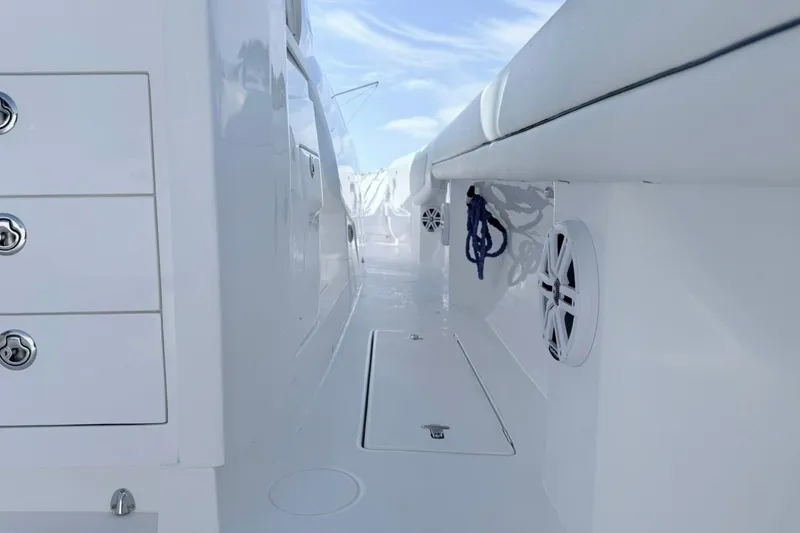 Slide: The Image of 2022 Intrepid 407 Panacea boat interior with storage compartments and speakers. - 55