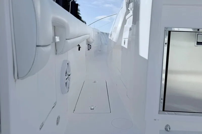 Slide: The Image of 2022 Intrepid 407 Panacea boat interior with sleek white design and modern features. - 56