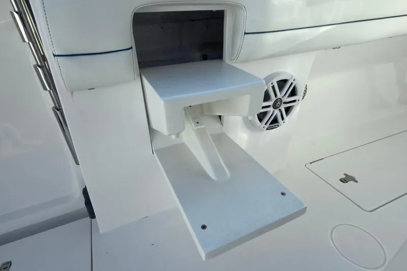 Slide: The Image of Fold-out step on 2022 Intrepid 407 Panacea boat, near speaker and storage compartment. - 58