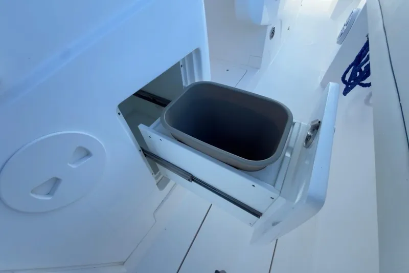 Slide: The Image of 2022 Intrepid 407 Panacea boat with a pull-out storage compartment. - 64