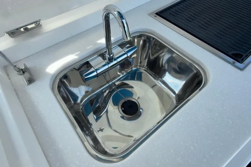 Slide: The Image of Stainless steel sink on 2022 Intrepid 407 Panacea boat, featuring modern faucet design. - 65