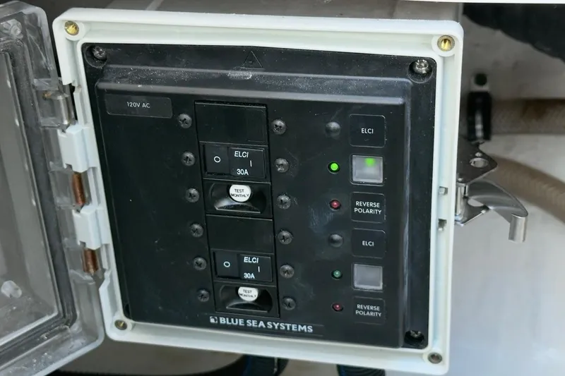 Slide: The Image of Electrical panel on 2022 Intrepid 407 Panacea boat by Blue Sea Systems, showing ELCI and reverse polarity indicators. - 76