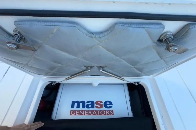 Slide: The Image of 2022 Intrepid 407 Panacea with Mase generator compartment open, showcasing interior details. - 78