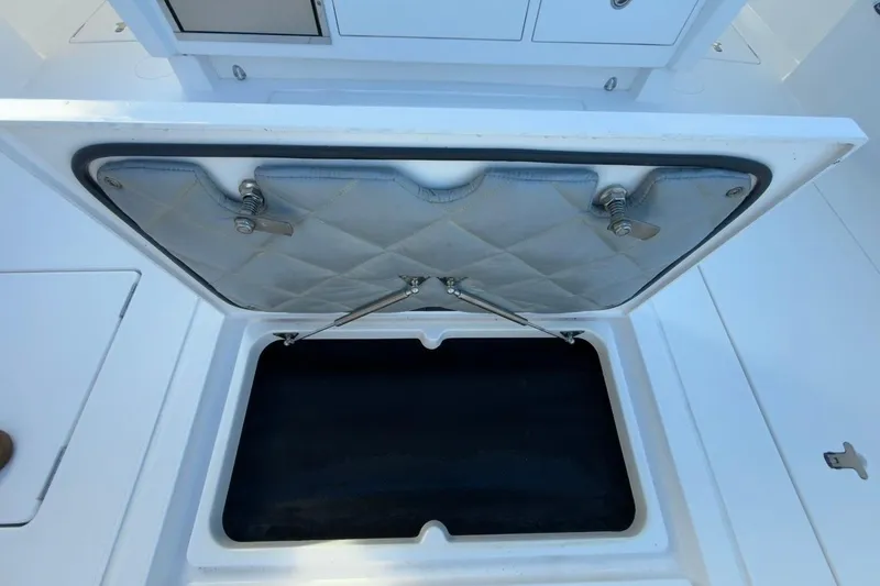 Slide: The Image of Open storage compartment on 2022 Intrepid 407 Panacea boat deck. - 80
