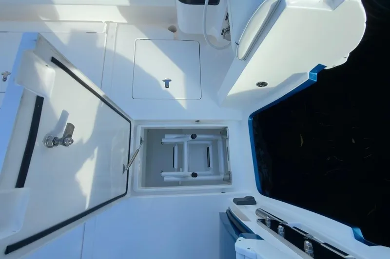 Slide: The Image of 2022 Intrepid 407 Panacea boat storage compartment with open hatch. - 82