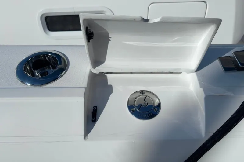 Slide: The Image of 2022 Intrepid 407 Panacea boat detail with open compartment and chrome fittings. - 86
