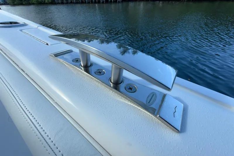 Slide: The Image of 2022 Intrepid 407 Panacea boat cleat on deck by water. - 91