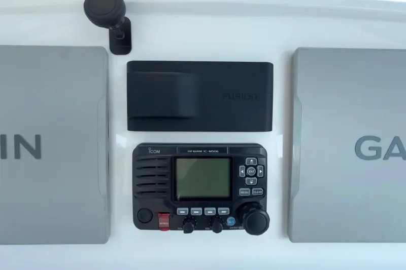 Slide: The Image of Control panel of 2022 Intrepid 407 Panacea with Garmin and Icom marine electronics. - 95