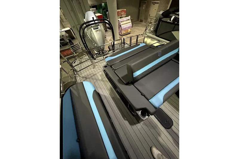 Slide: The Image of 2026 Godfrey Monaco 255 SFL boat interior with sleek seating and modern design. - 11