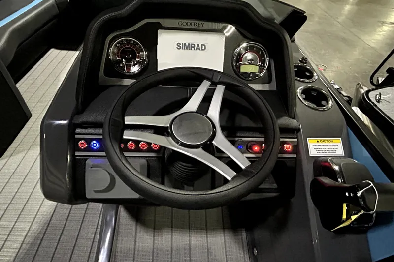 Slide: The Image of 2026 Godfrey Monaco 255 SFL dashboard with steering wheel and Simrad display. - 7