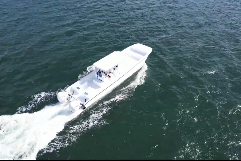 Slide: The Image of Aerial view of 2025 AmeraCat 39 boat cruising on open water. - 13