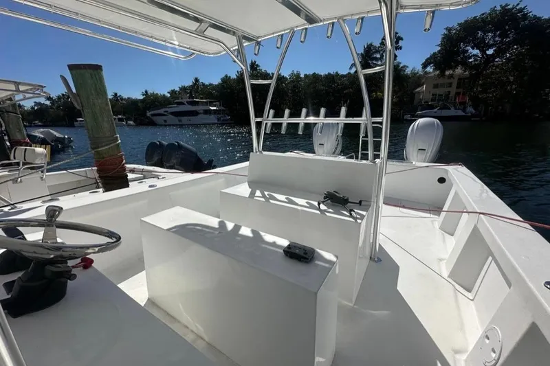 Slide: The Image of 2025 AmeraCat 39 boat interior with steering wheel, seating, and water view. - 3